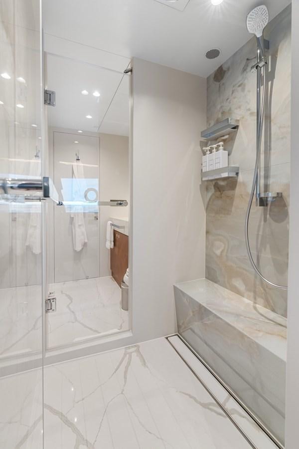 a bathroom with a shower unit and sink aboard JEMILY II Yacht for Sale
