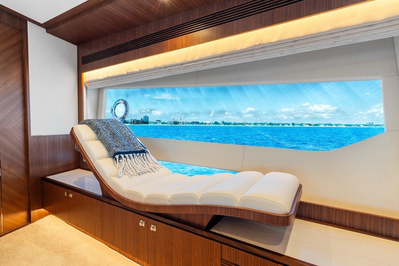 a room with a bed and a pool aboard JEMILY II Yacht for Sale