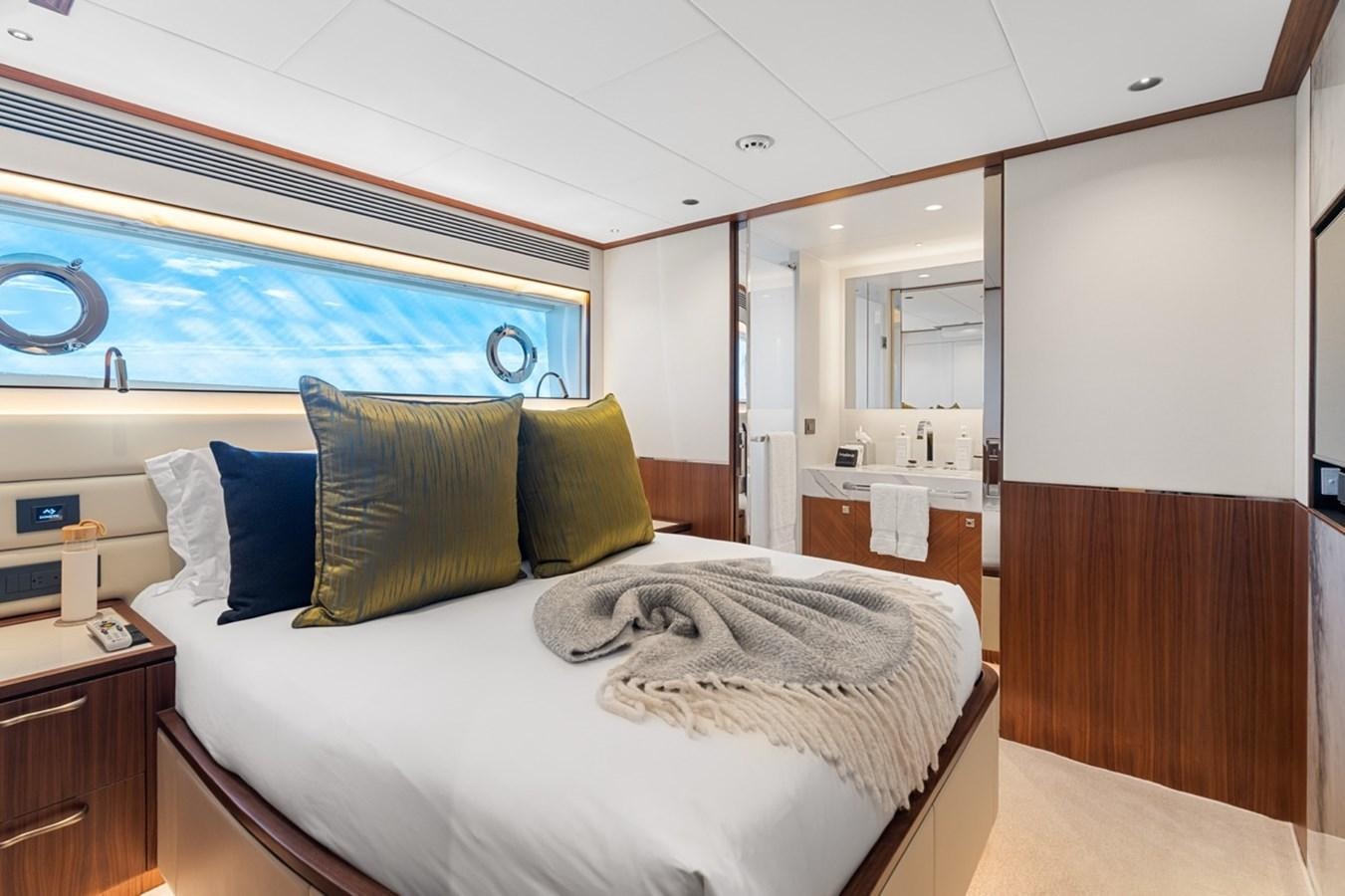 a bed with pillows on it aboard JEMILY II Yacht for Sale