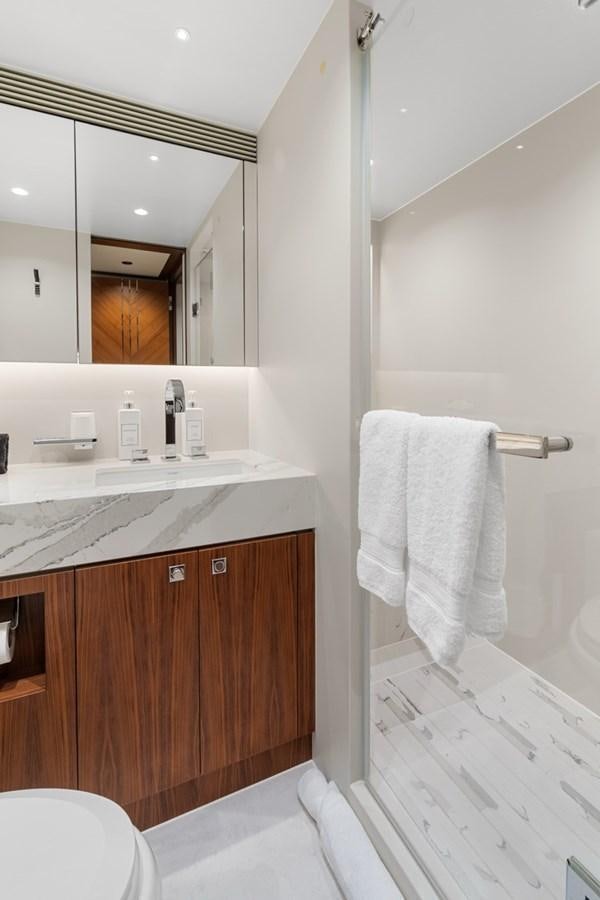 a bathroom with a sink and a mirror aboard JEMILY II Yacht for Sale