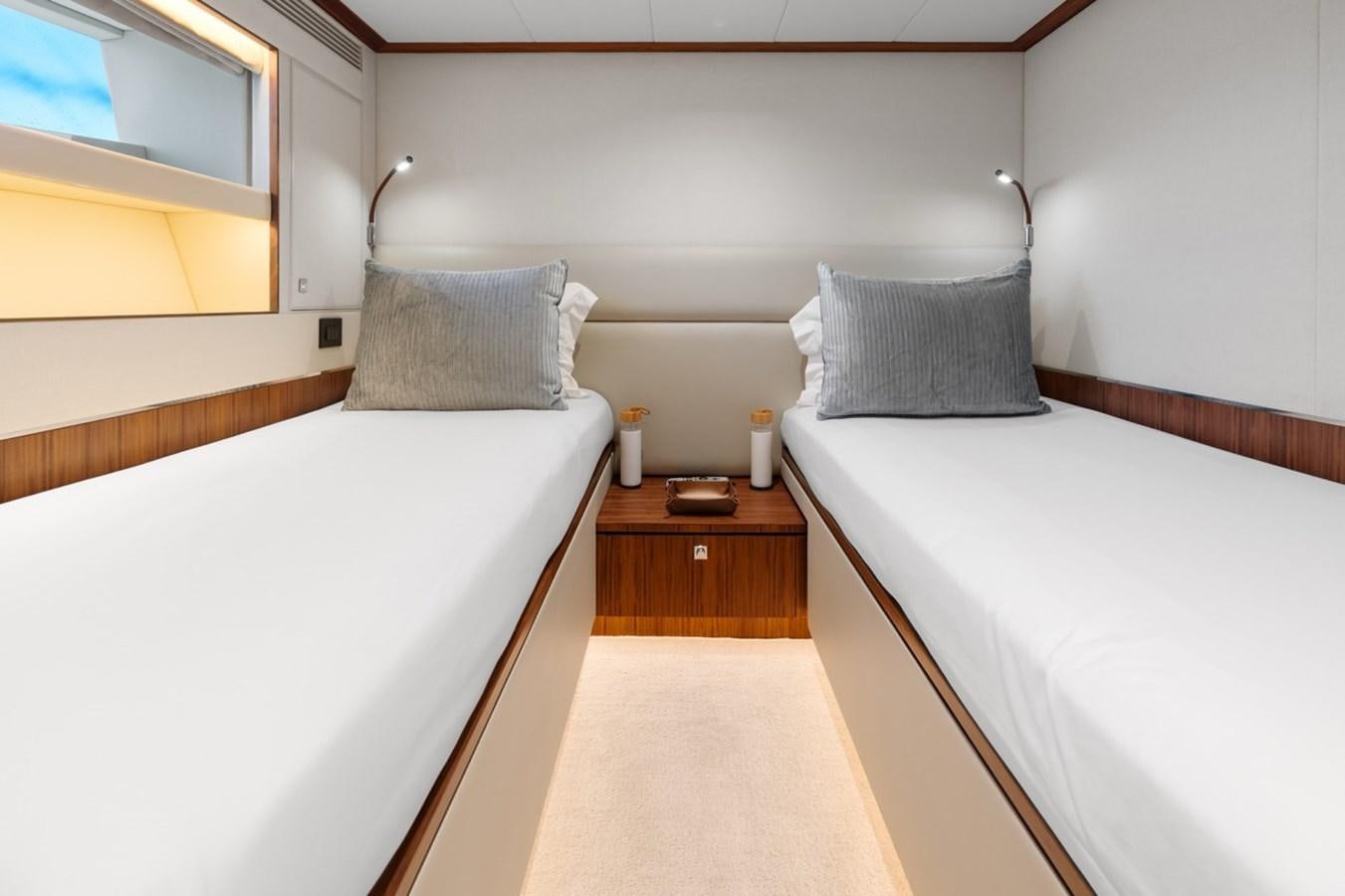 a room with two beds aboard JEMILY II Yacht for Sale