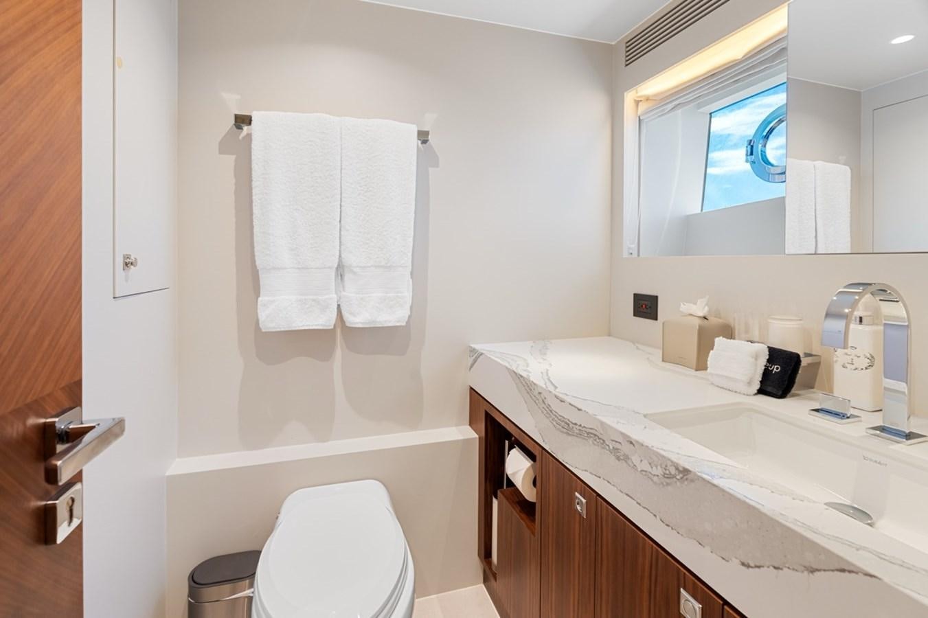 a bathroom with a sink and toilet aboard JEMILY II Yacht for Sale