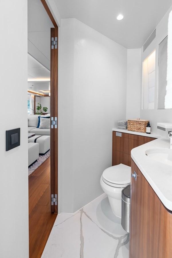 a bathroom with a toilet and sink aboard JEMILY II Yacht for Sale