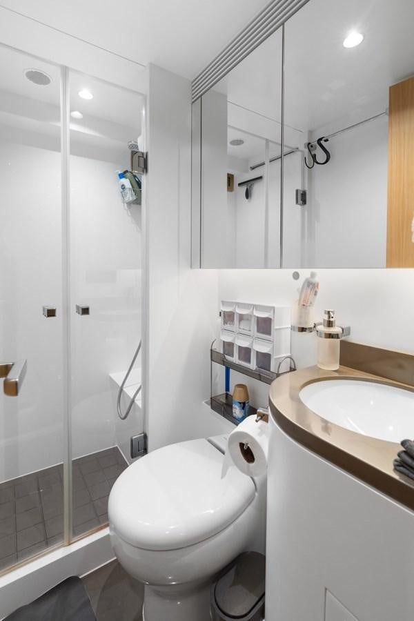 a bathroom with a shower and toilet aboard JEMILY II Yacht for Sale