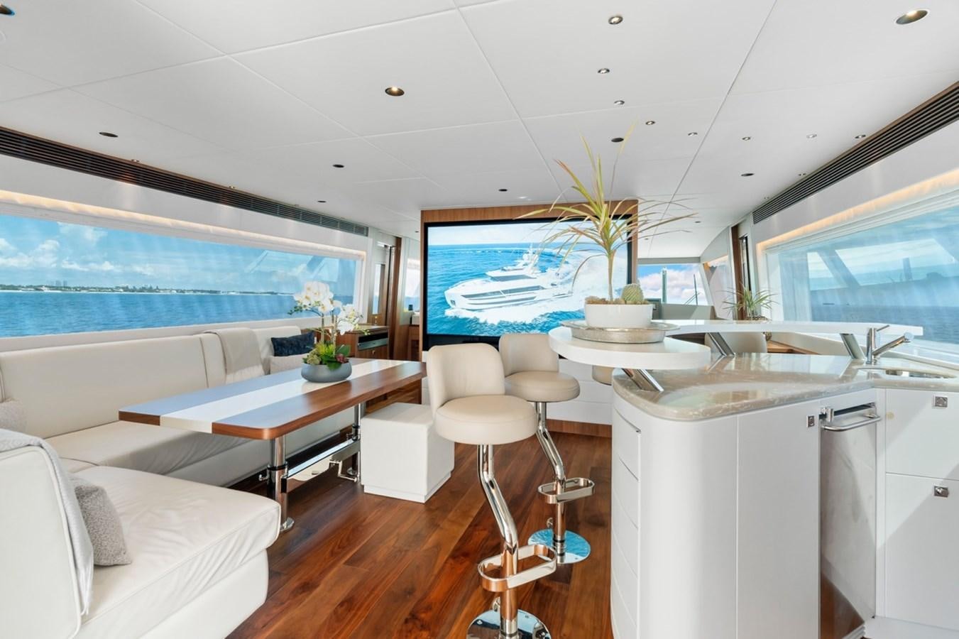 a modern looking kitchen with a large window aboard JEMILY II Yacht for Sale