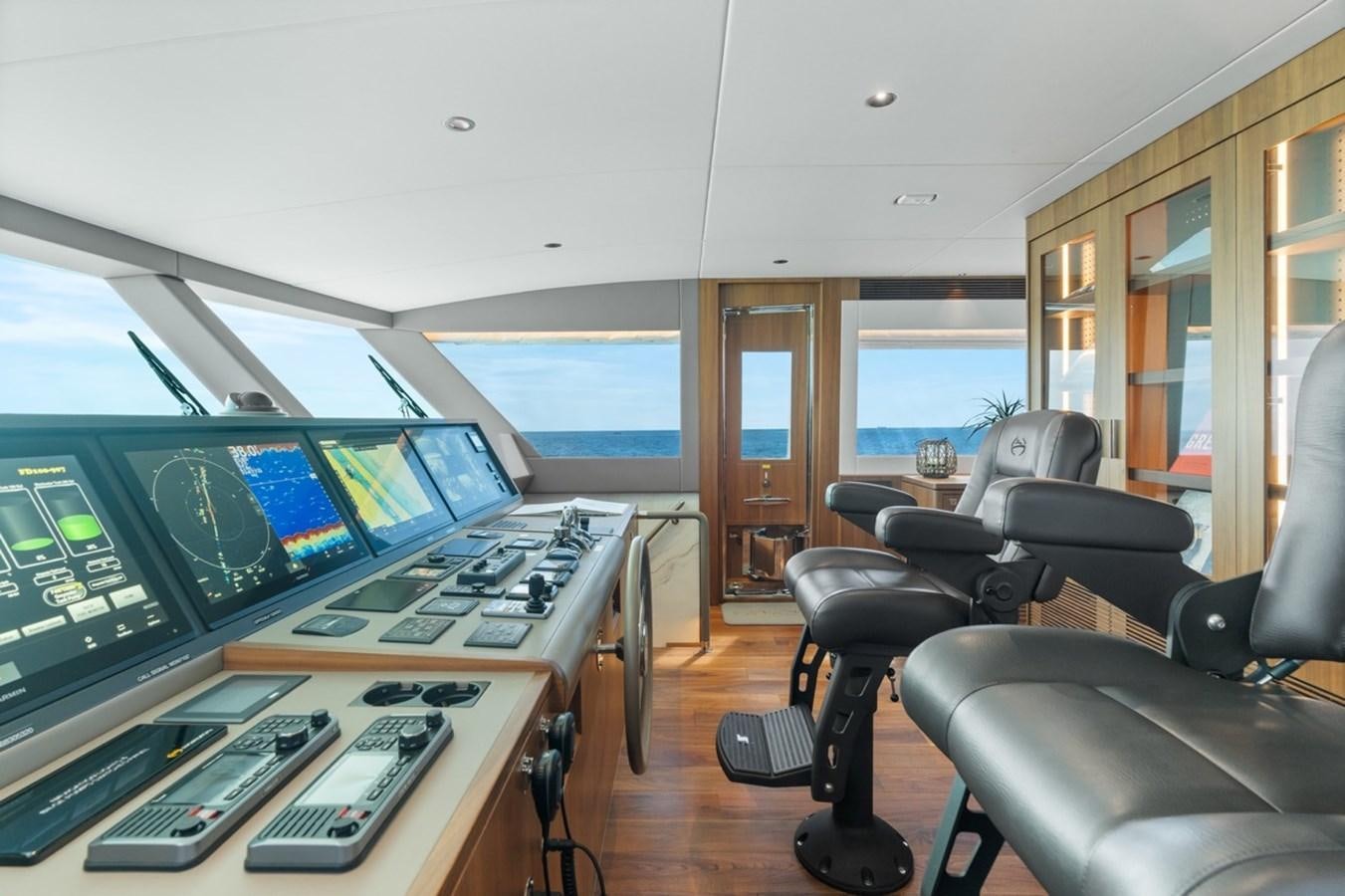 a control room with several monitors aboard JEMILY II Yacht for Sale