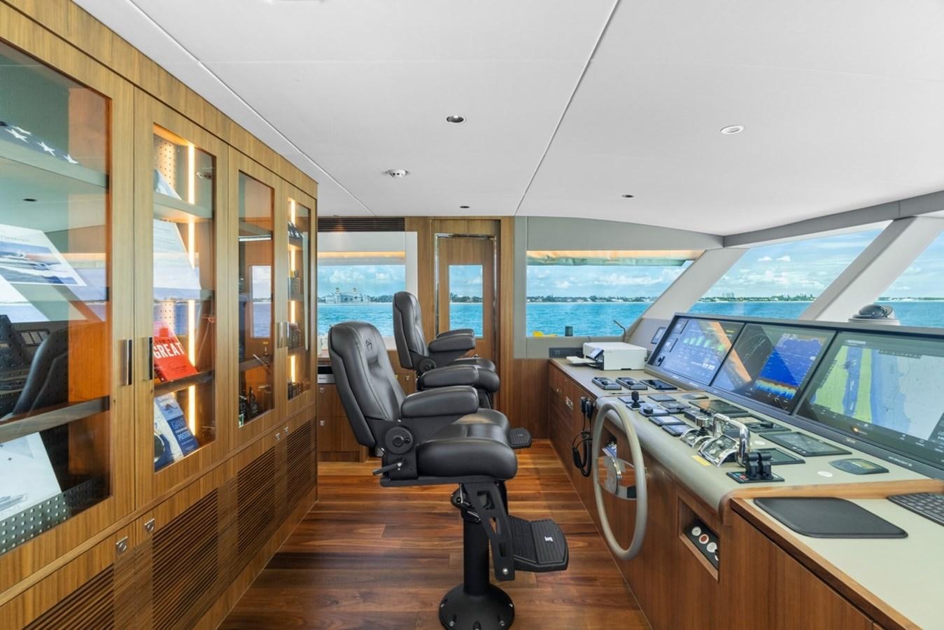 a room with computers and monitors aboard JEMILY II Yacht for Sale