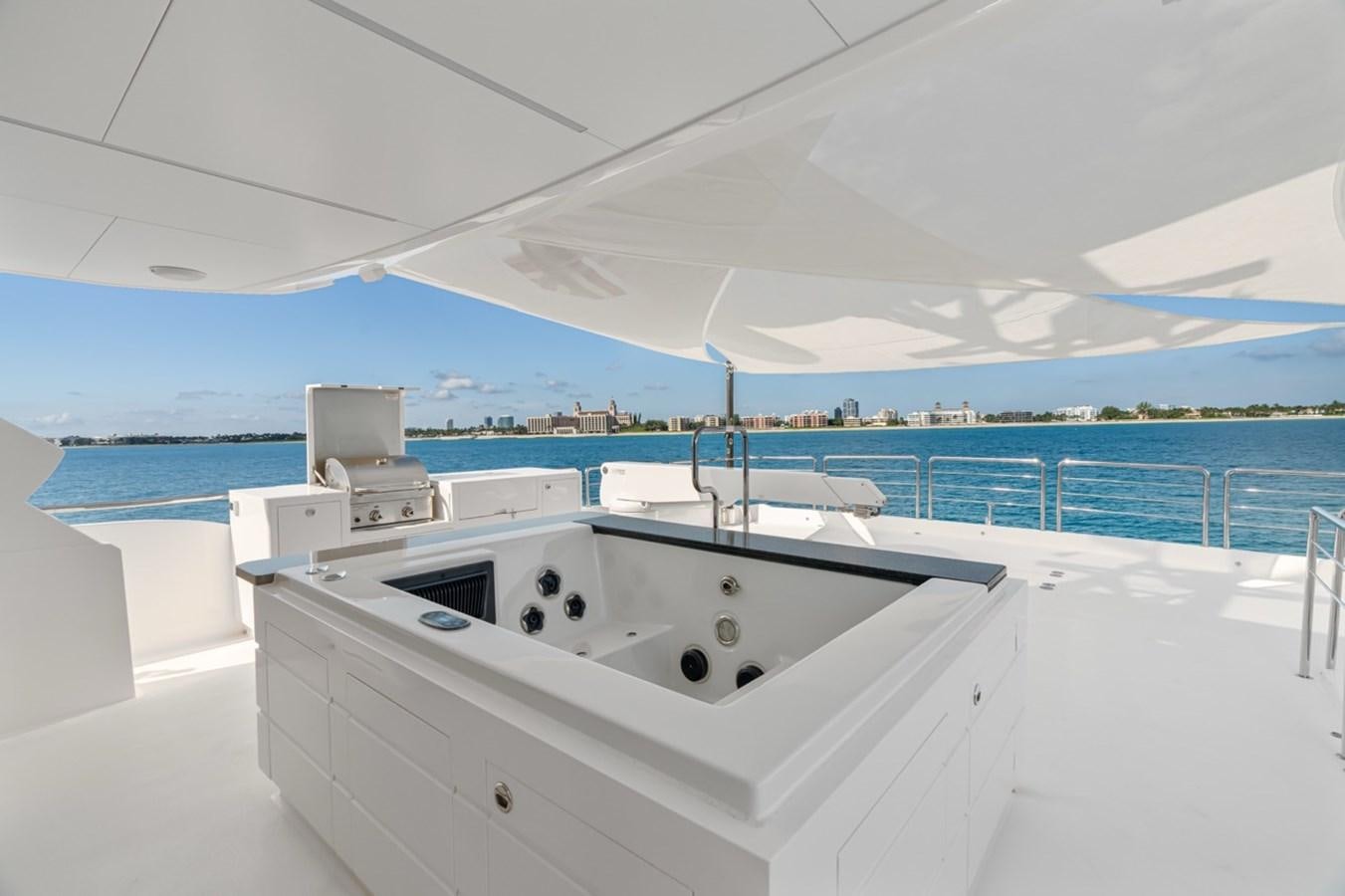 a large white pool with a large white pool and a large building in the background aboard JEMILY II Yacht for Sale