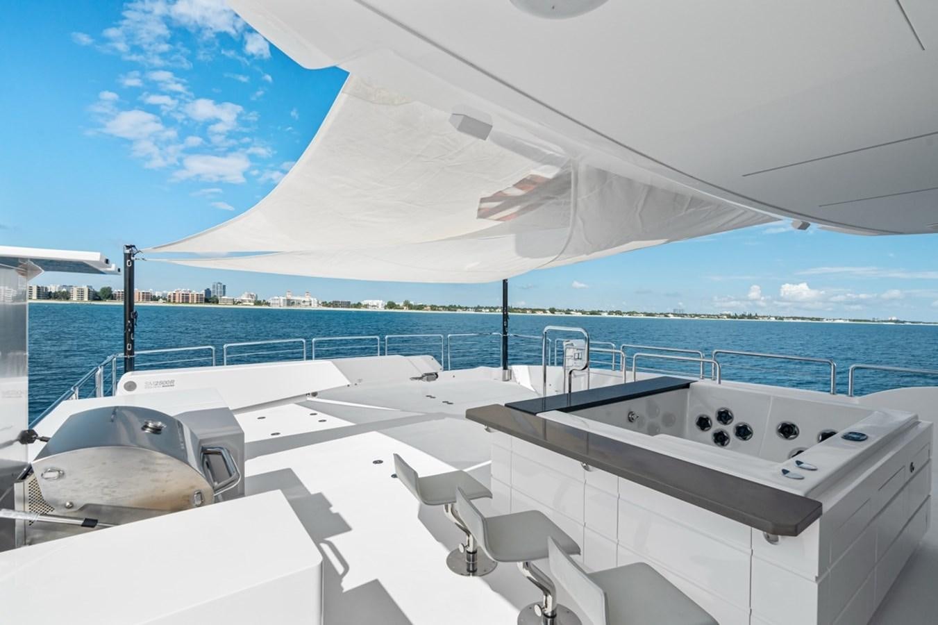 a large white boat on a body of water aboard JEMILY II Yacht for Sale