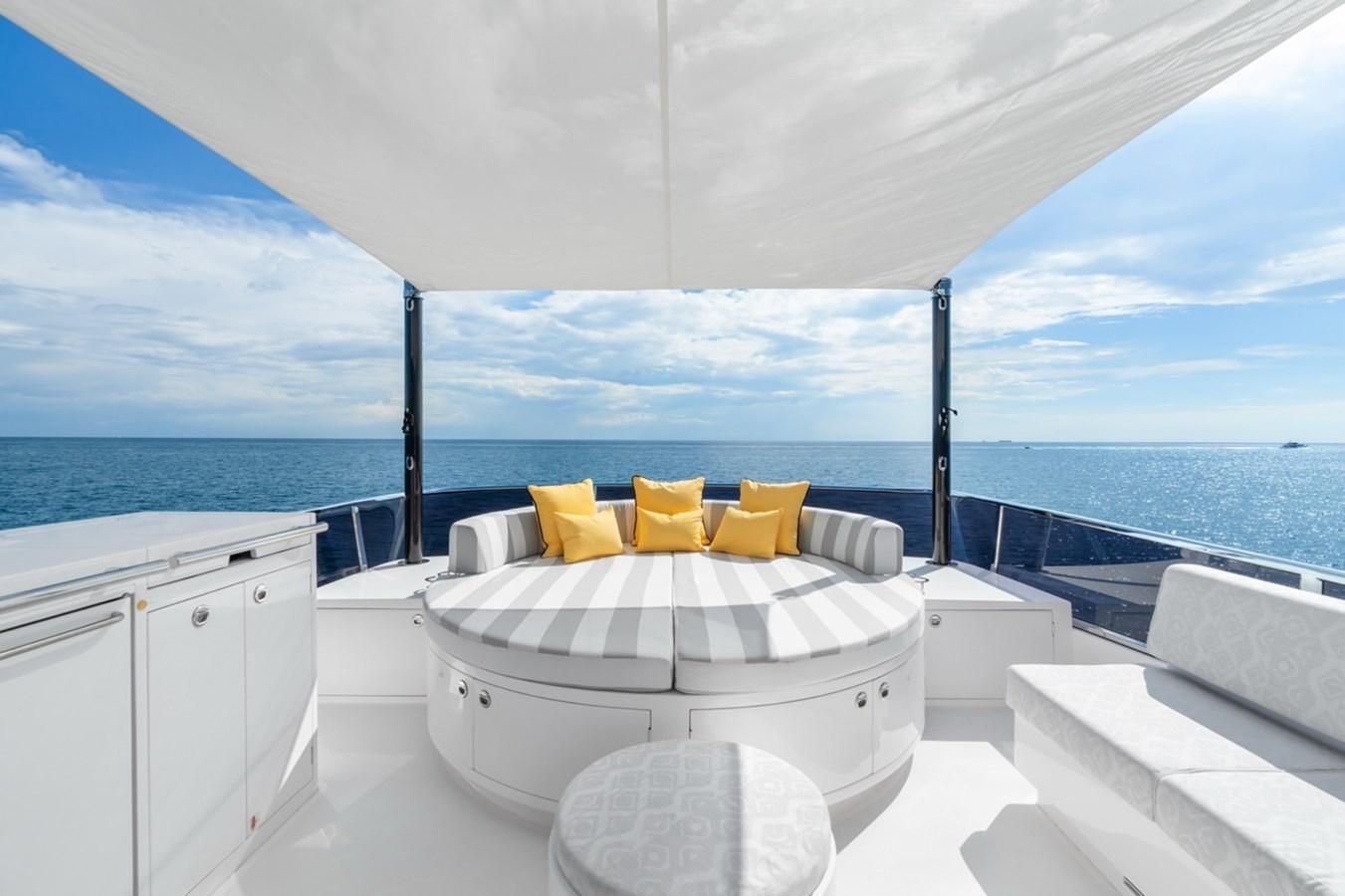 a white bathtub with yellow pillows aboard JEMILY II Yacht for Sale