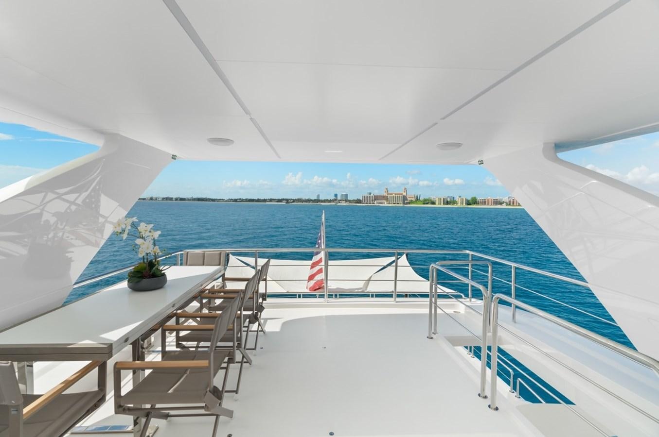 a view of a beach from a balcony aboard JEMILY II Yacht for Sale