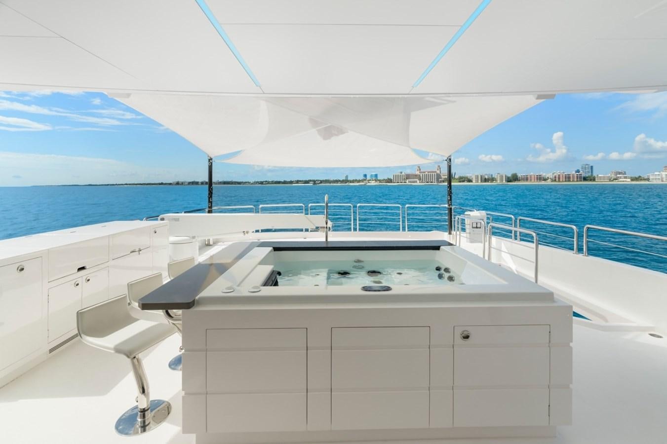 a white boat on a body of water aboard JEMILY II Yacht for Sale