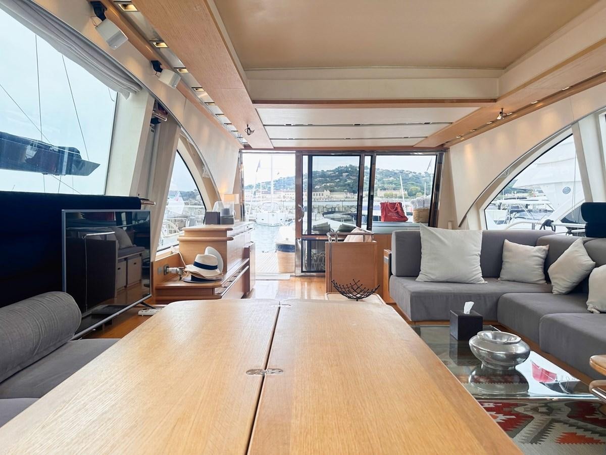 a living room with a large window aboard MEMORY Yacht for Sale