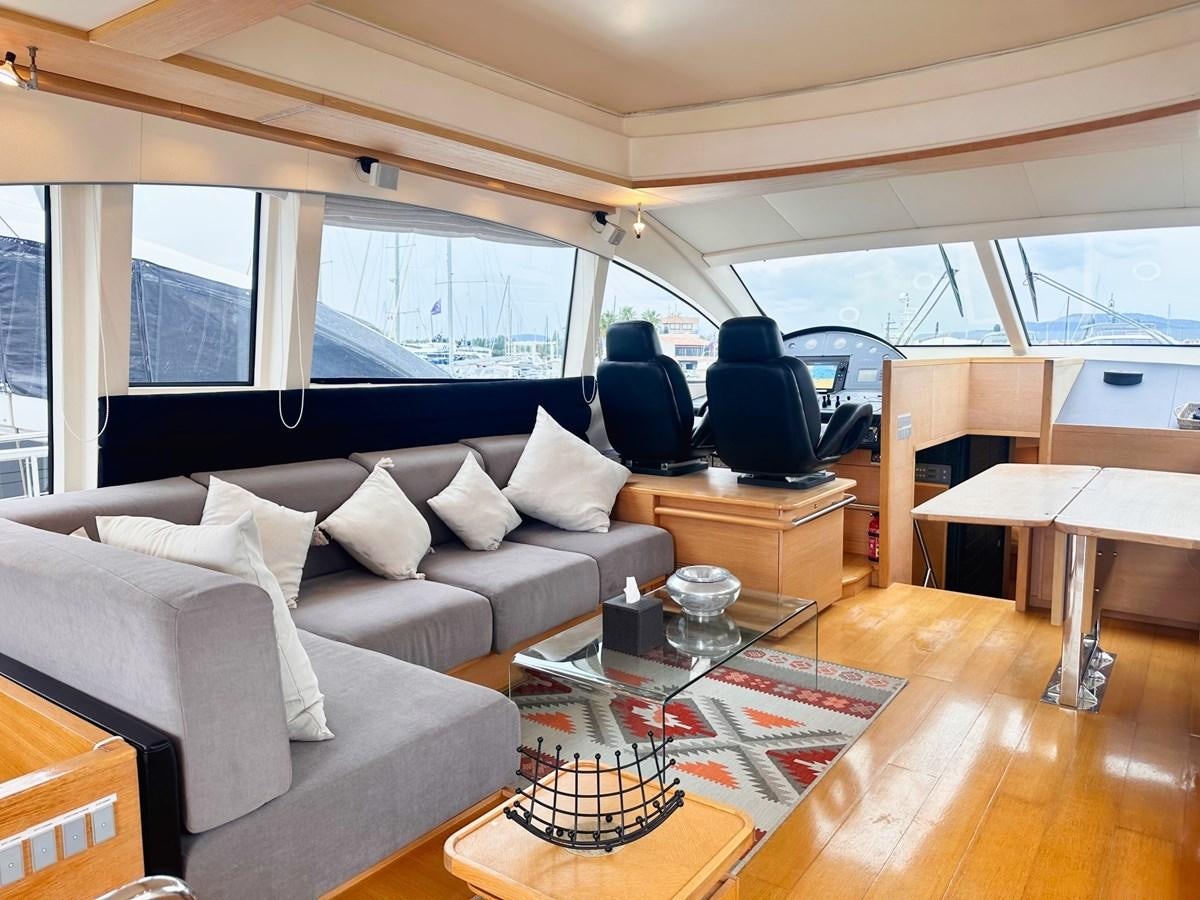 a living room with a couch and a coffee table aboard MEMORY Yacht for Sale