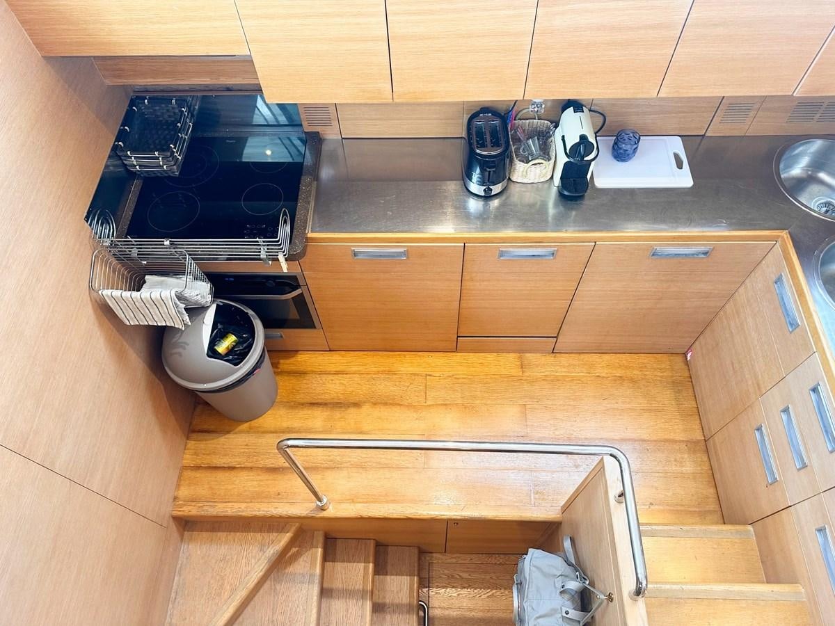 a kitchen with a stove and cabinets aboard MEMORY Yacht for Sale