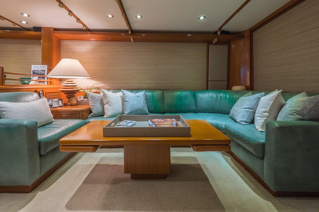 a living room with a couch and a coffee table aboard THANKS BUDS Yacht for Sale