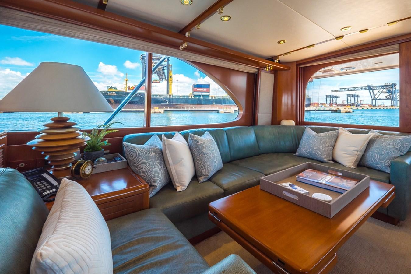 a living room with a large window aboard THANKS BUDS Yacht for Sale