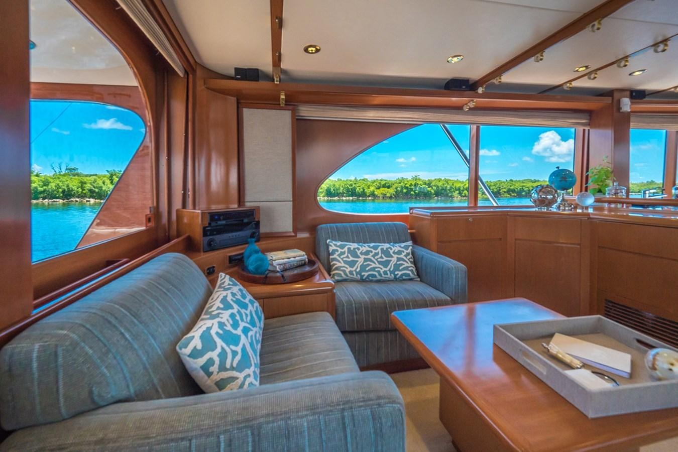 a living room with a couch and a table aboard THANKS BUDS Yacht for Sale