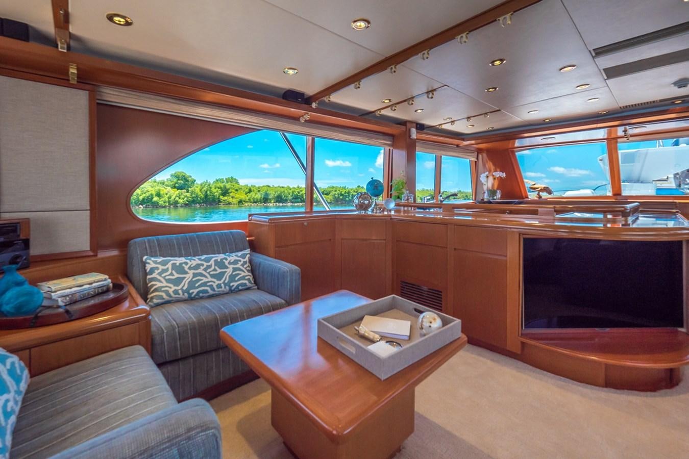 a living room with a couch and a coffee table aboard THANKS BUDS Yacht for Sale