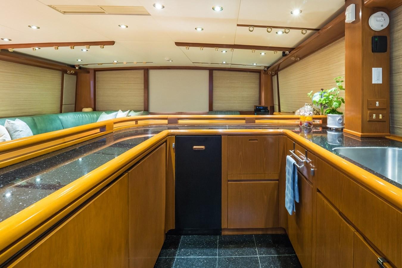 a kitchen with wooden cabinets aboard THANKS BUDS Yacht for Sale