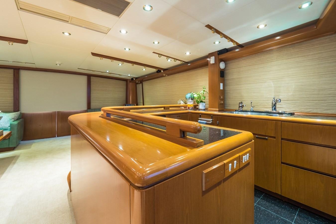 a kitchen with wooden cabinets aboard THANKS BUDS Yacht for Sale