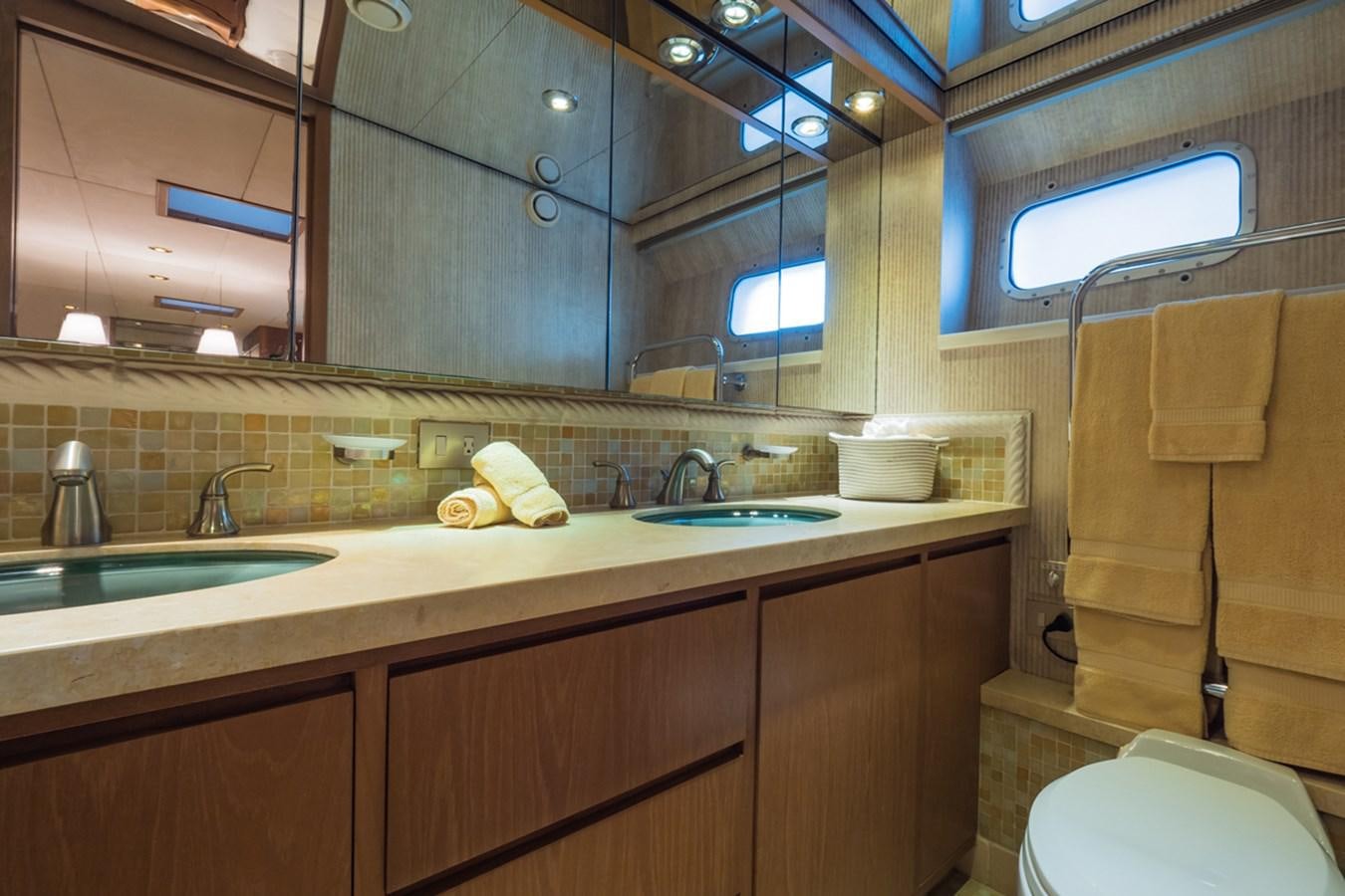 a bathroom with a sink and a mirror aboard THANKS BUDS Yacht for Sale