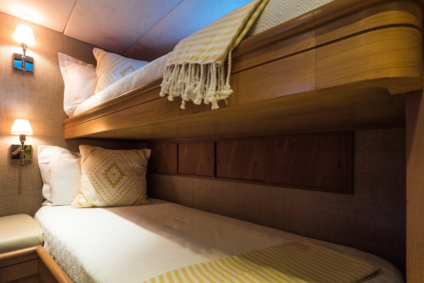 a bed with a headboard and pillows aboard THANKS BUDS Yacht for Sale