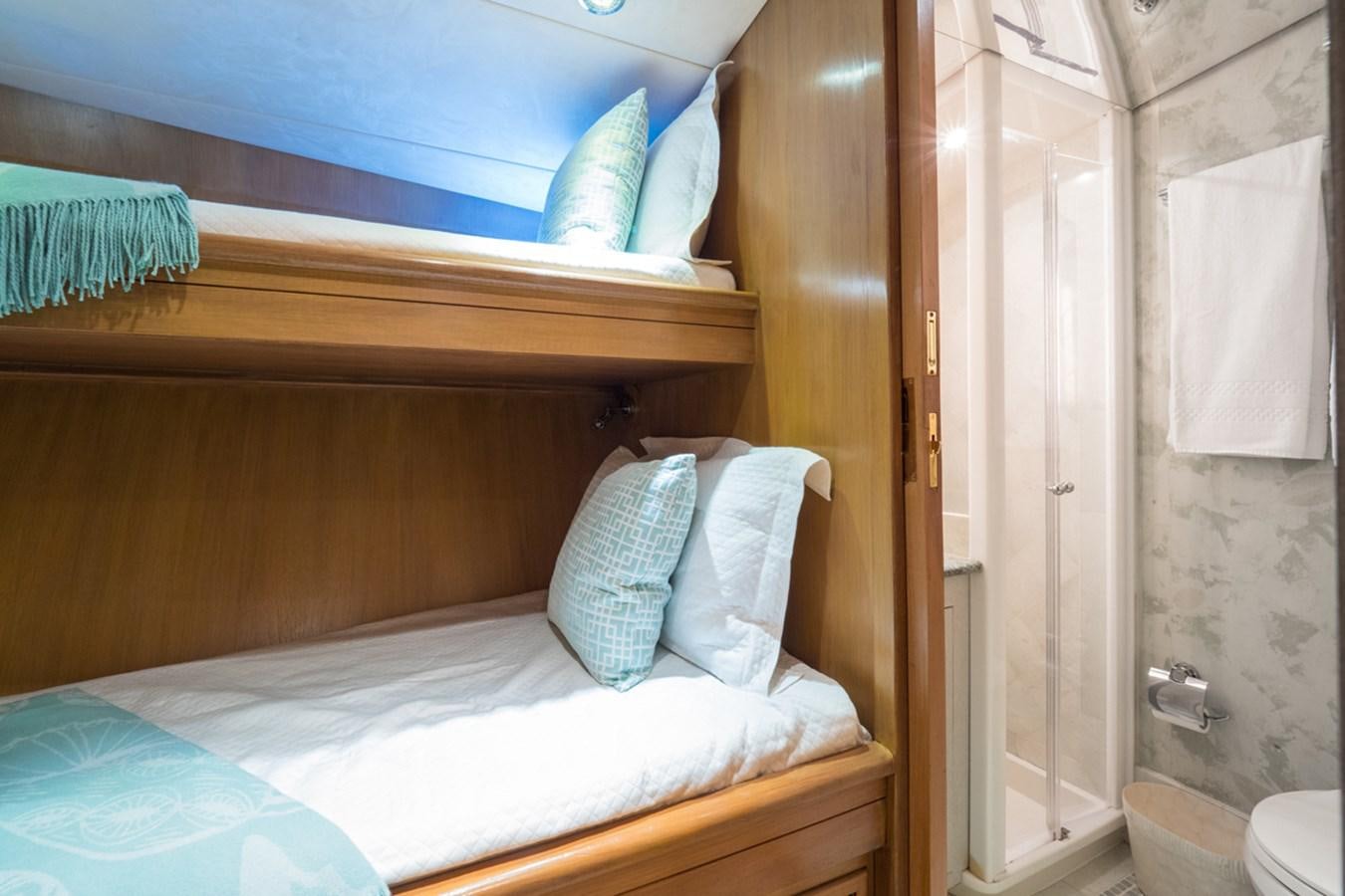 a room with two beds aboard THANKS BUDS Yacht for Sale