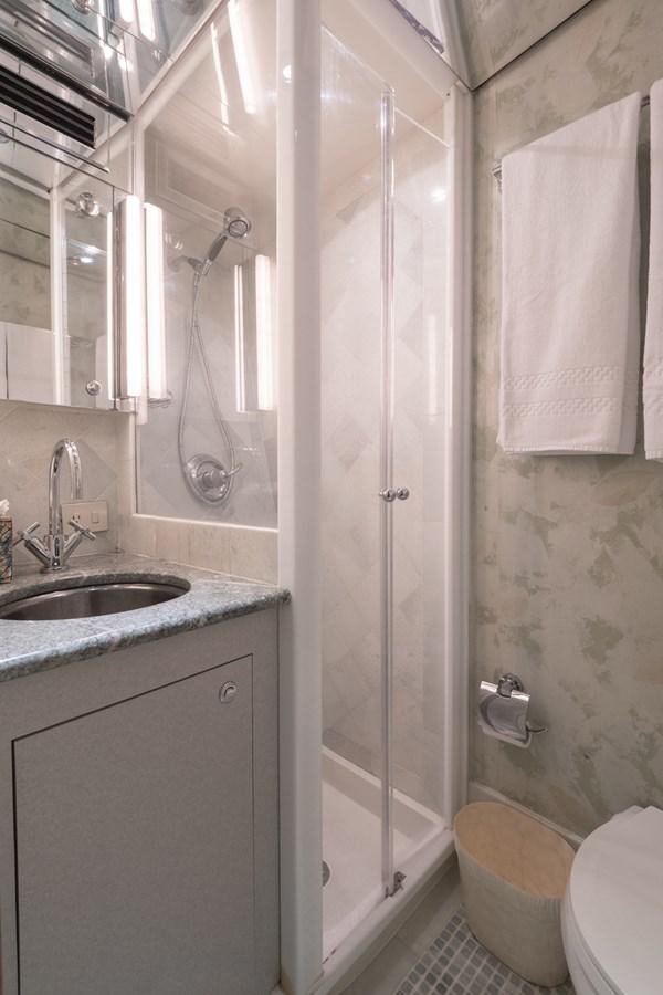 a bathroom with a shower and sink aboard THANKS BUDS Yacht for Sale