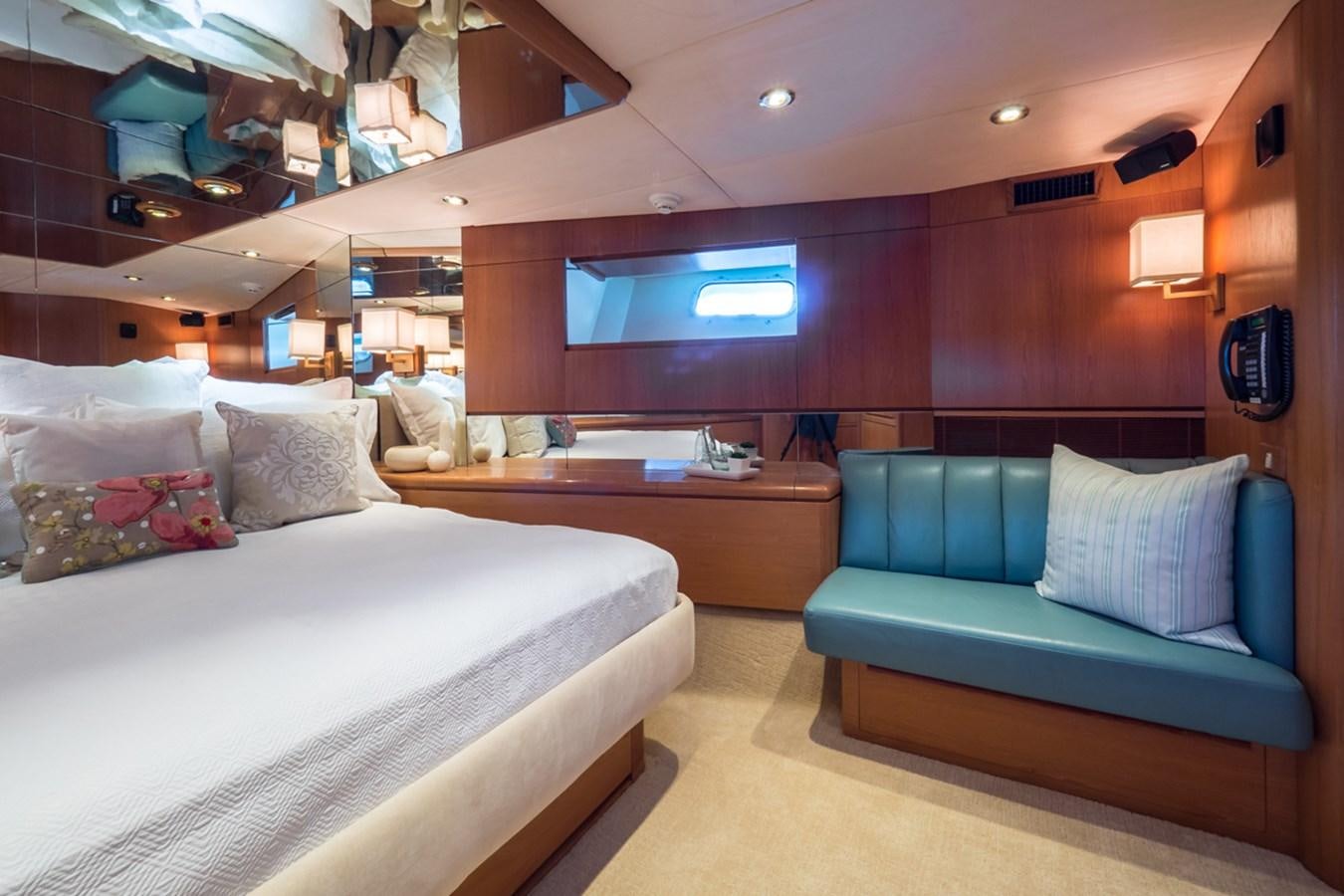 a room with a bed and a couch aboard THANKS BUDS Yacht for Sale
