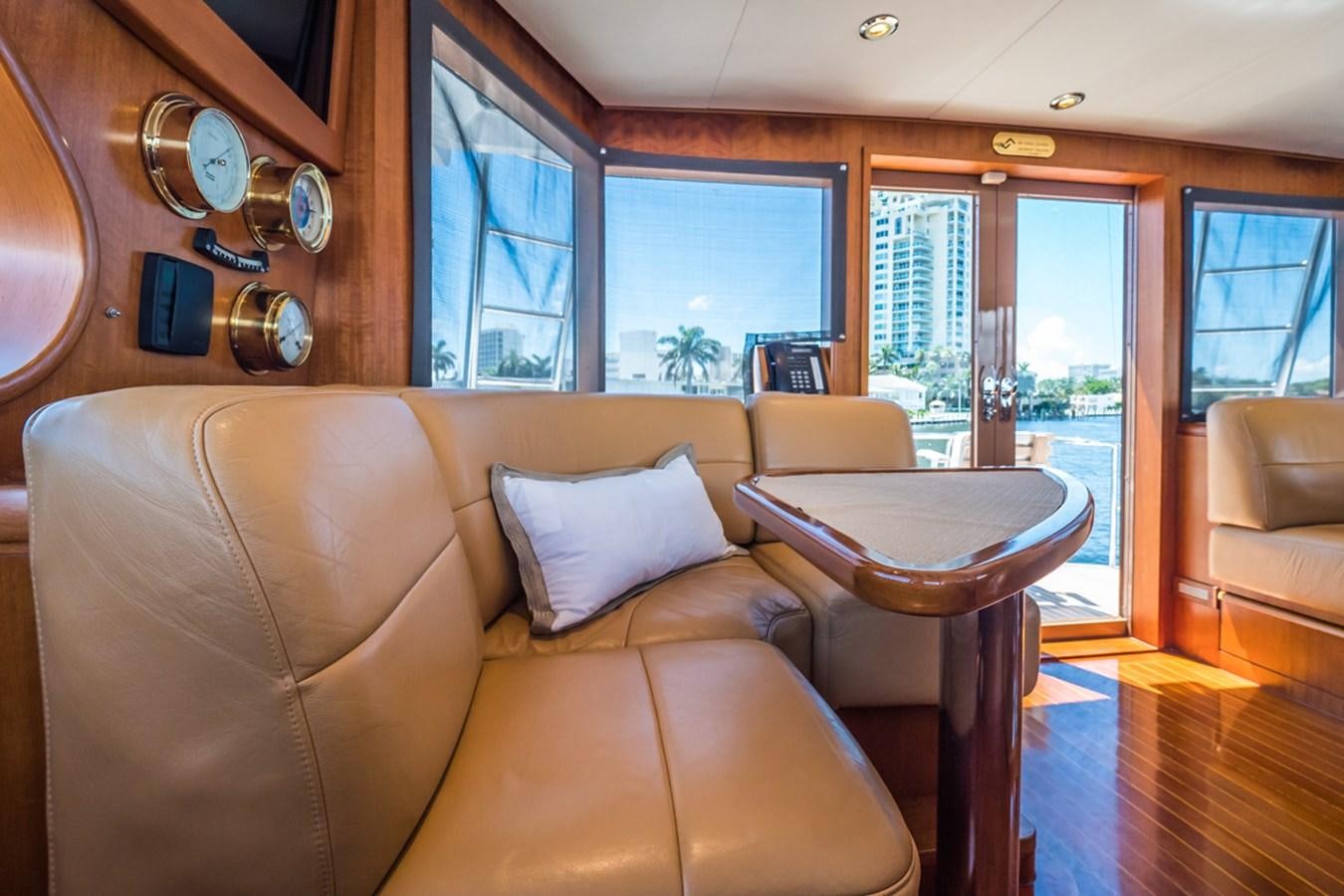 a living room with a couch and a table aboard THANKS BUDS Yacht for Sale