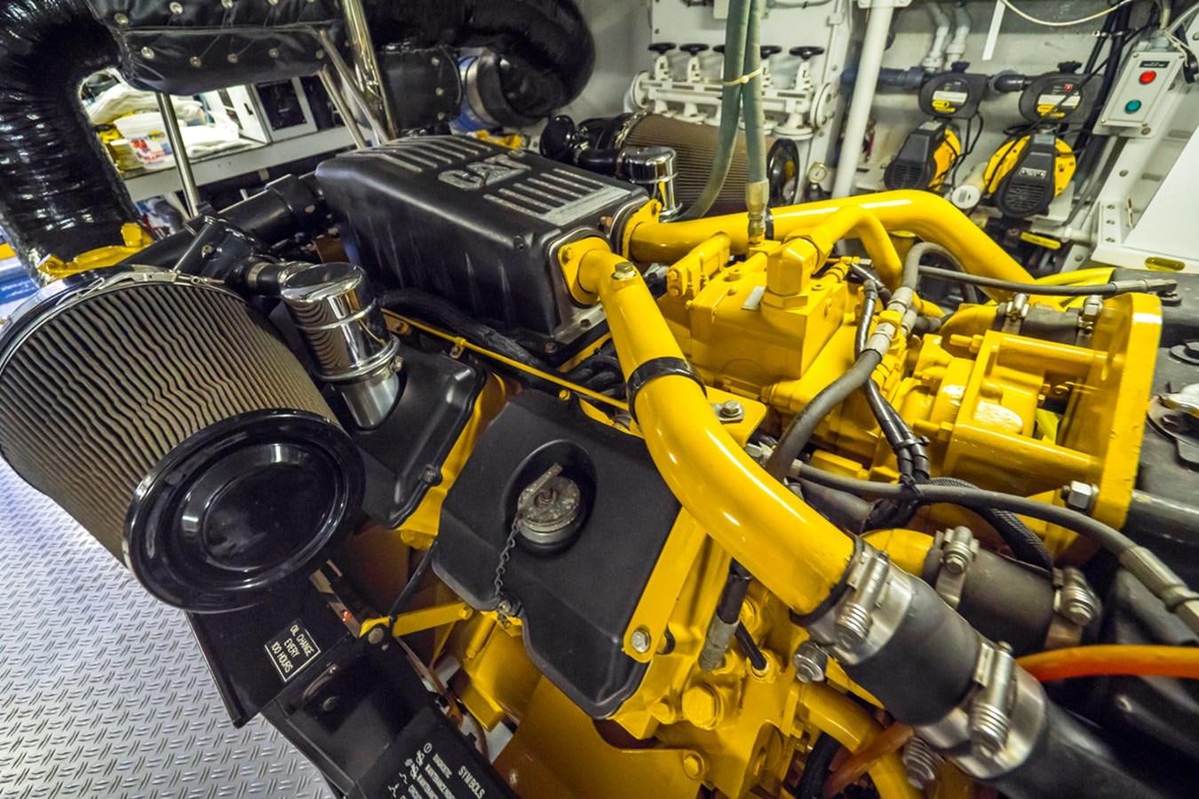 a yellow and black engine aboard THANKS BUDS Yacht for Sale