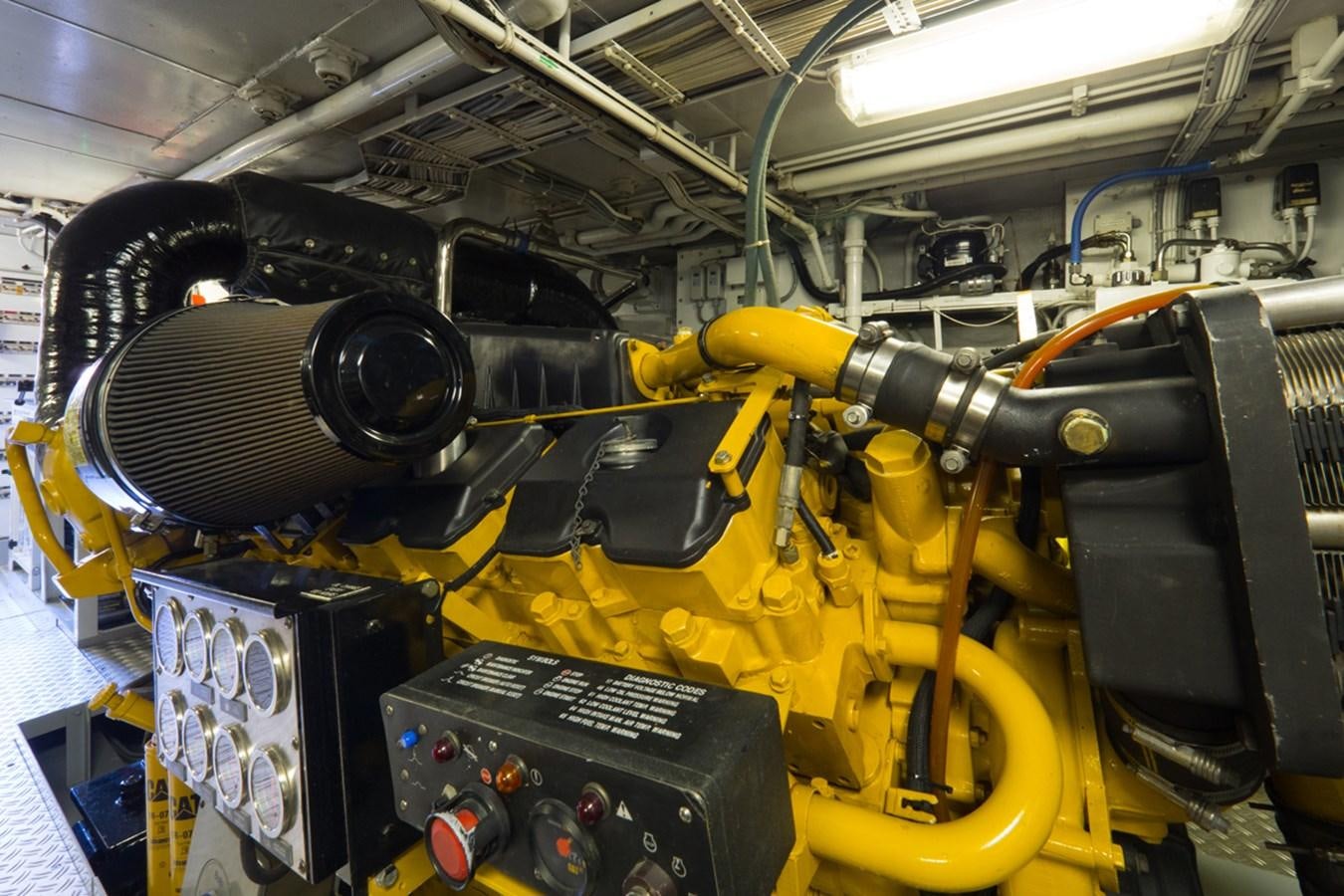 a yellow machine with black and orange parts aboard THANKS BUDS Yacht for Sale