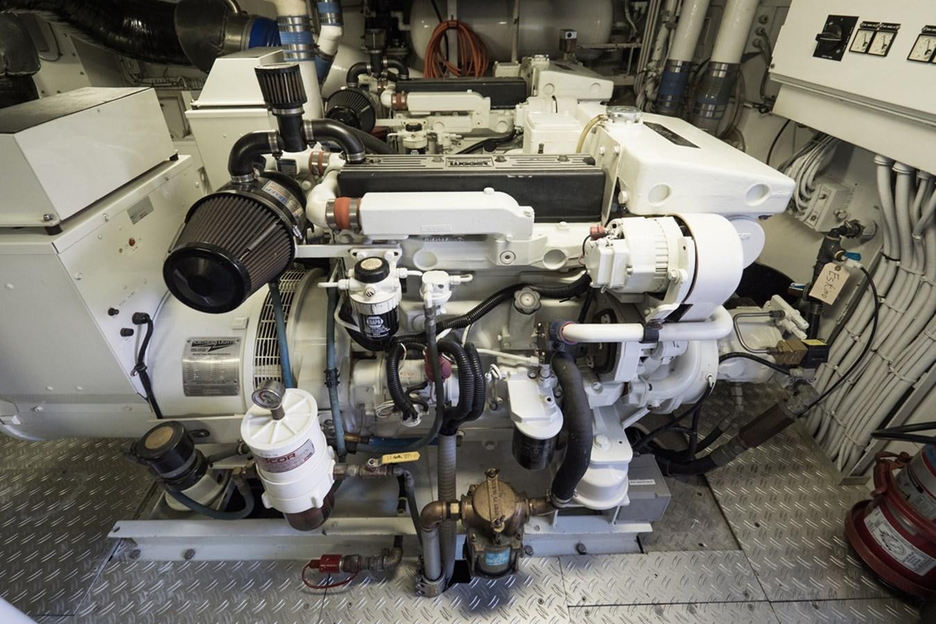 a car engine with a white cylinder aboard THANKS BUDS Yacht for Sale