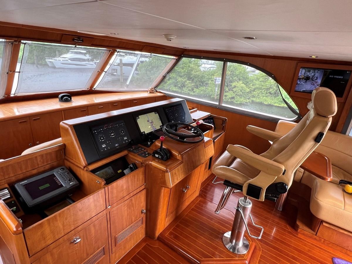 a room with a desk and chairs aboard THANKS BUDS Yacht for Sale