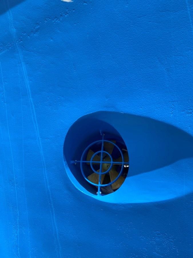 a car tire on a blue surface aboard THANKS BUDS Yacht for Sale