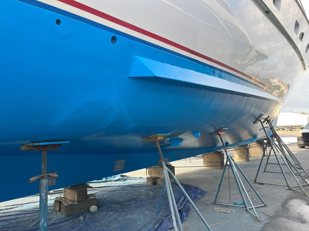 a large airplane with a ladder aboard THANKS BUDS Yacht for Sale