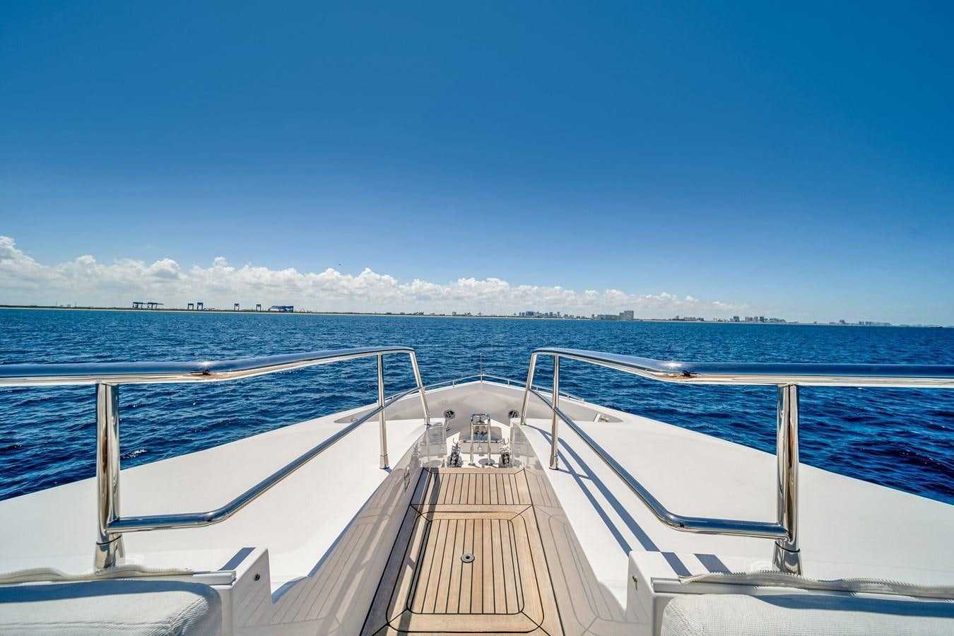a wooden dock over a body of water aboard FAMILYBILT Yacht for Sale