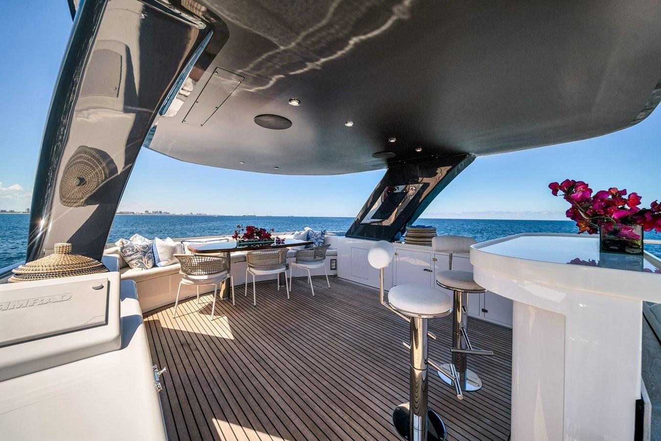 a room with a table and chairs aboard FAMILYBILT Yacht for Sale