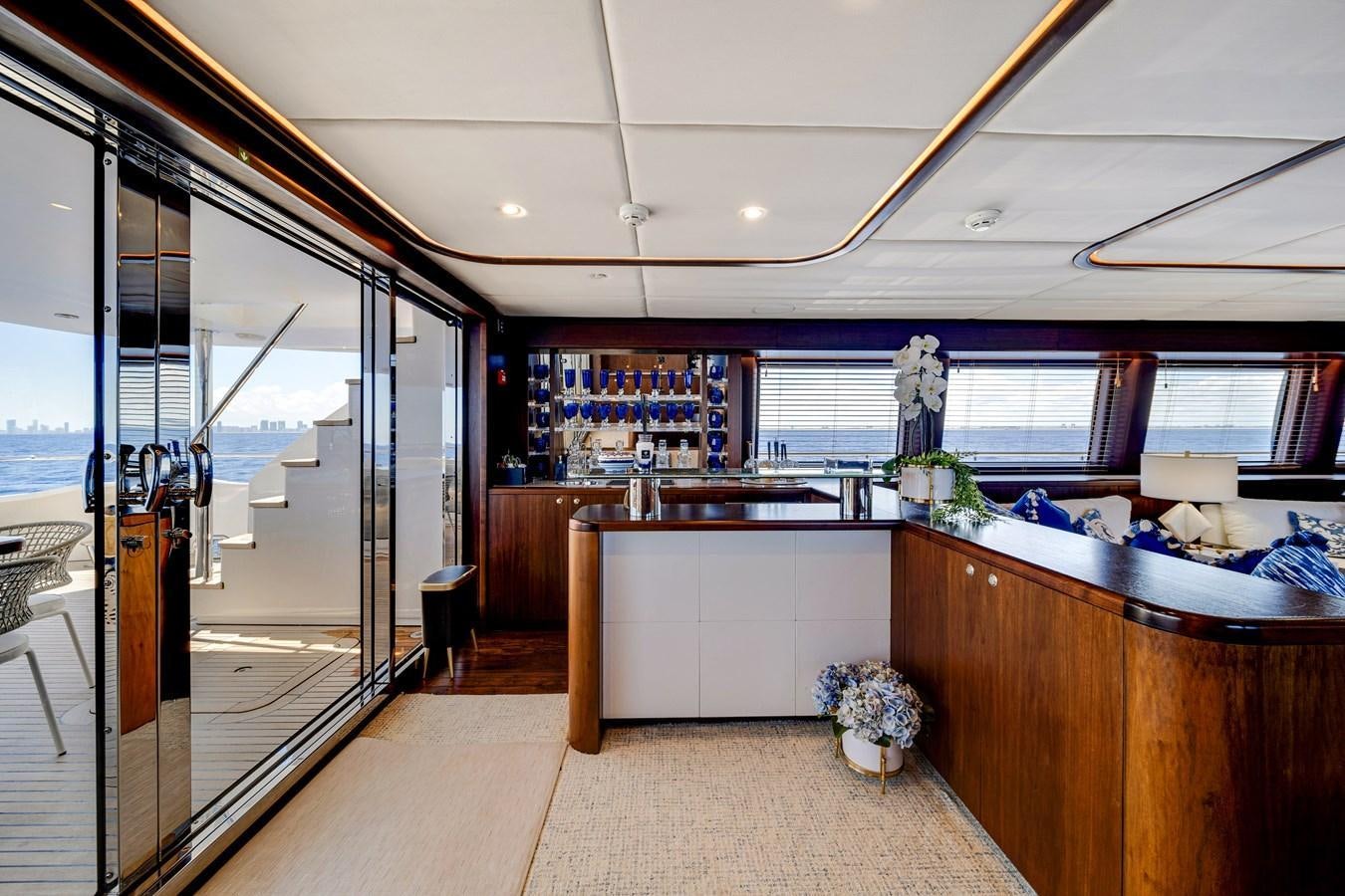 a large room with a glass door aboard FAMILYBILT Yacht for Sale