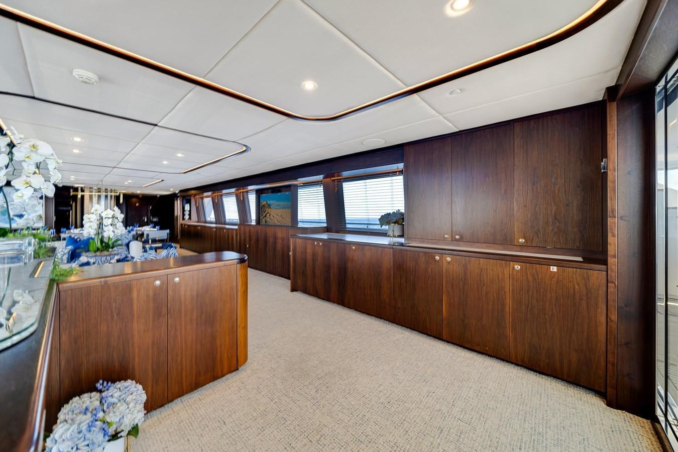 a large kitchen with wooden cabinets aboard FAMILYBILT Yacht for Sale