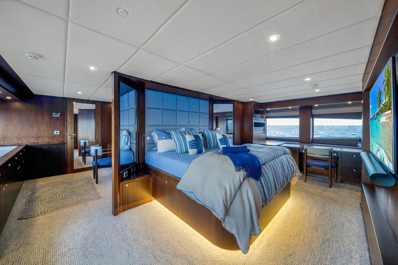 a large bedroom with a large window aboard FAMILYBILT Yacht for Sale
