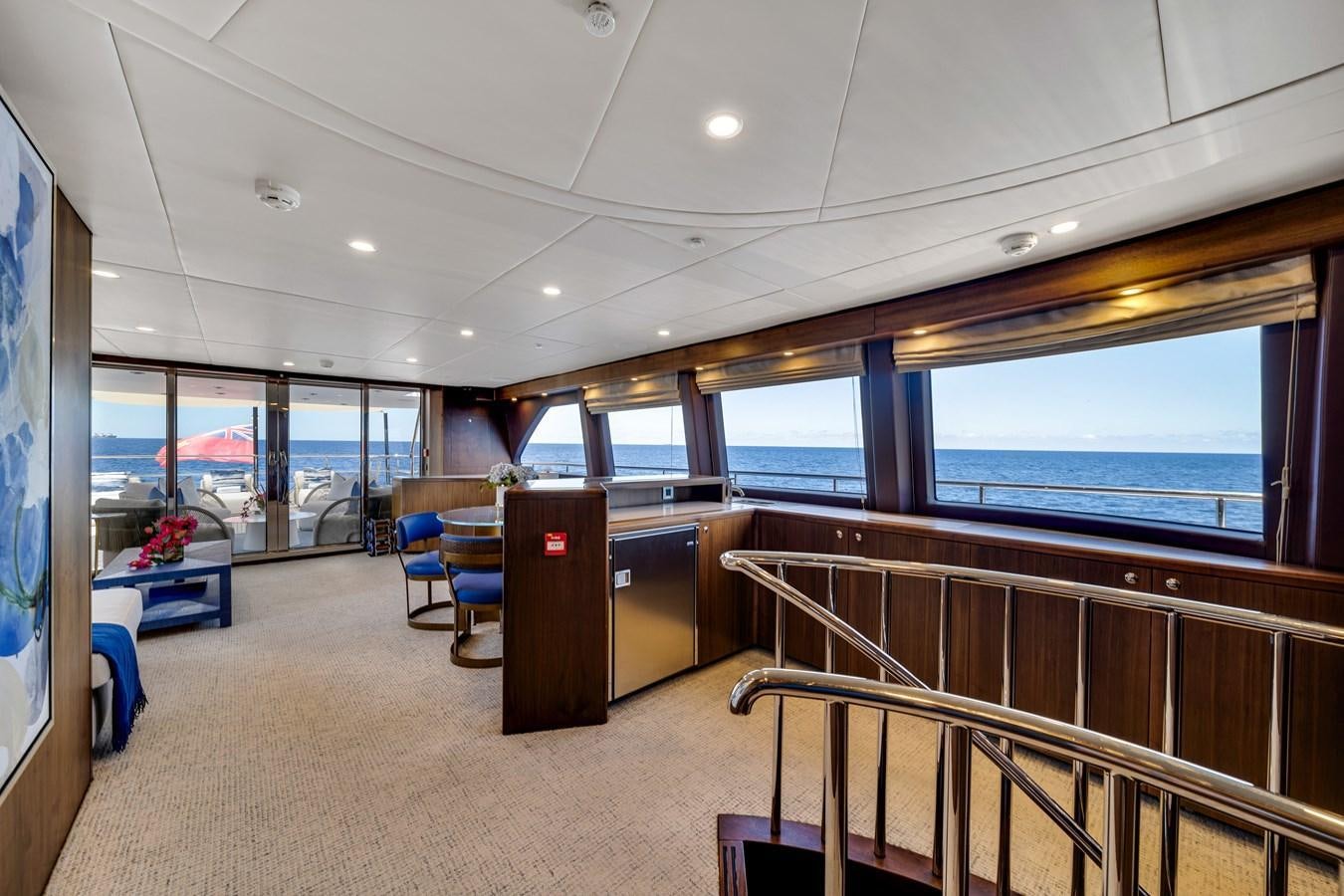 inside view of a room with a large window and a view of the city aboard FAMILYBILT Yacht for Sale