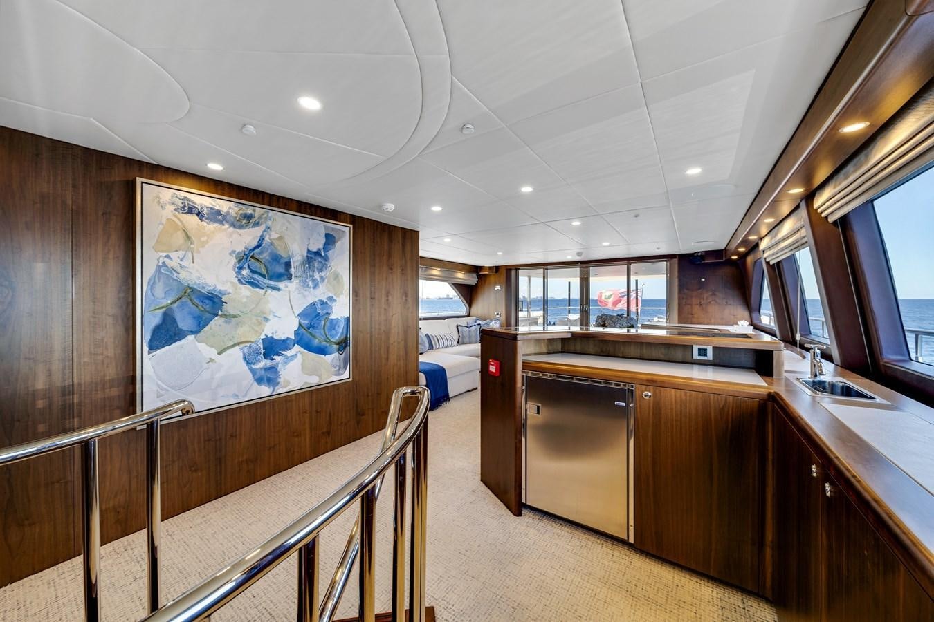 a large room with wooden cabinets aboard FAMILYBILT Yacht for Sale