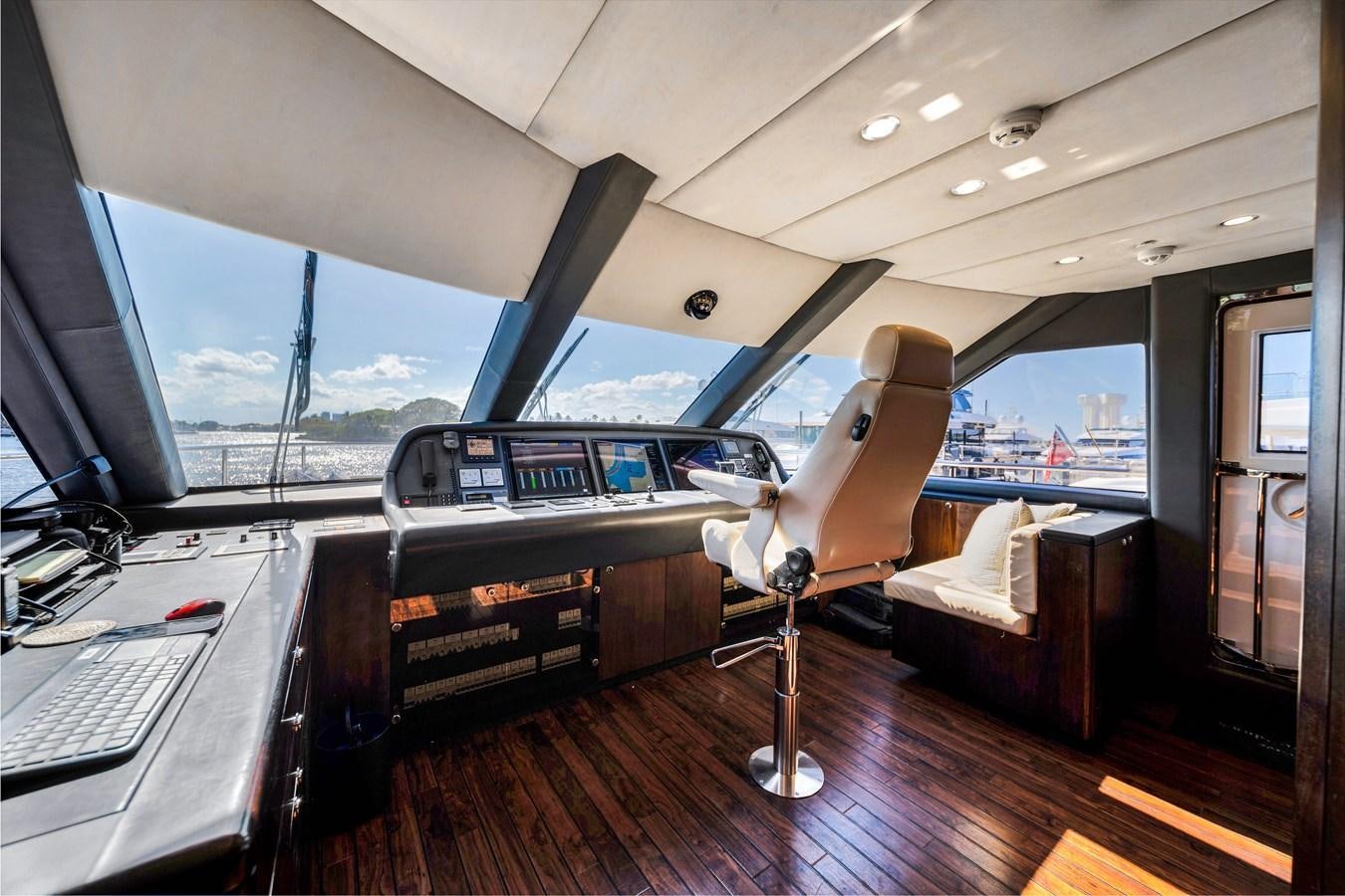 inside of a car with a large window and a large deck with a view of the ocean and aboard FAMILYBILT Yacht for Sale