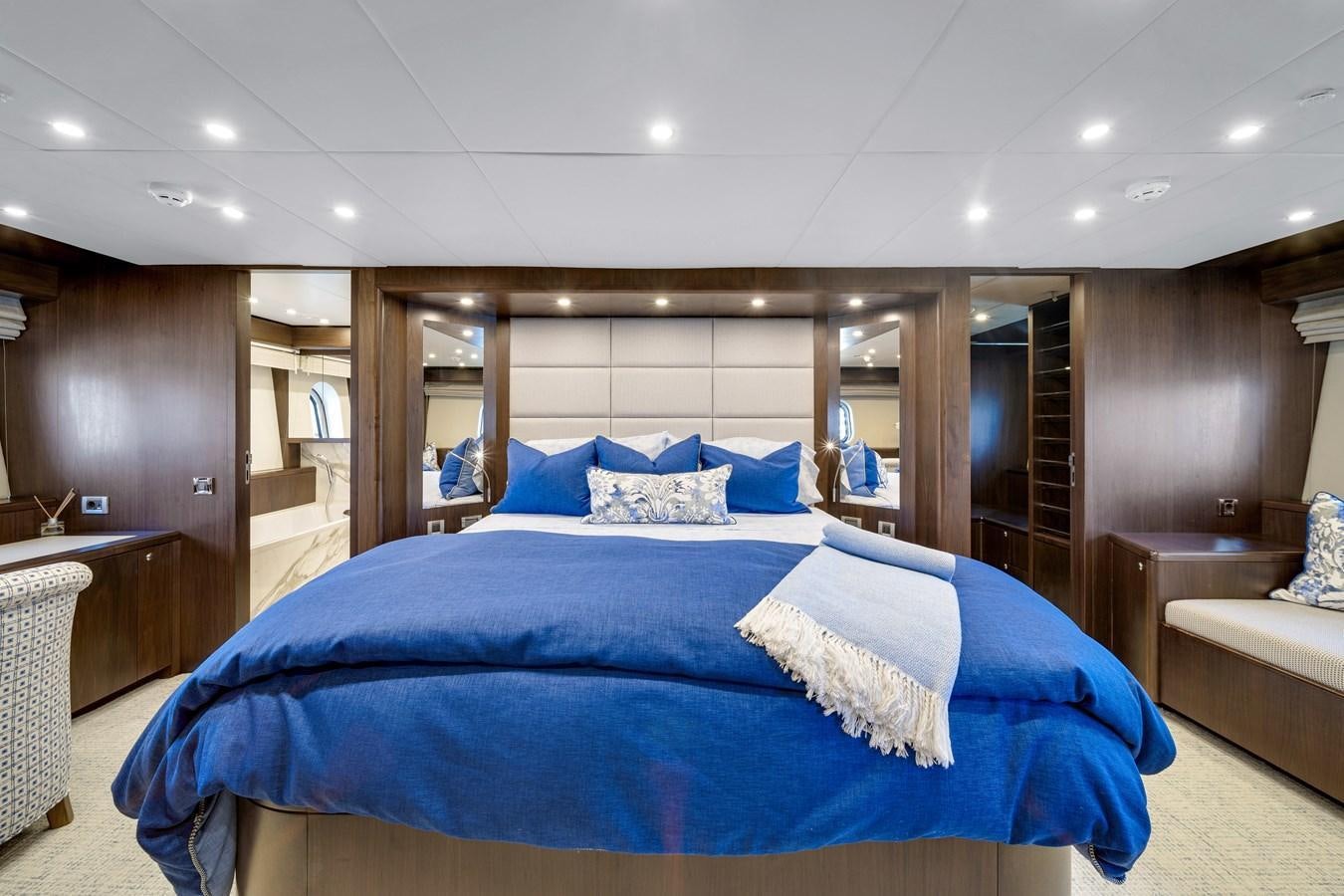 a bedroom with a large bed aboard FAMILYBILT Yacht for Sale