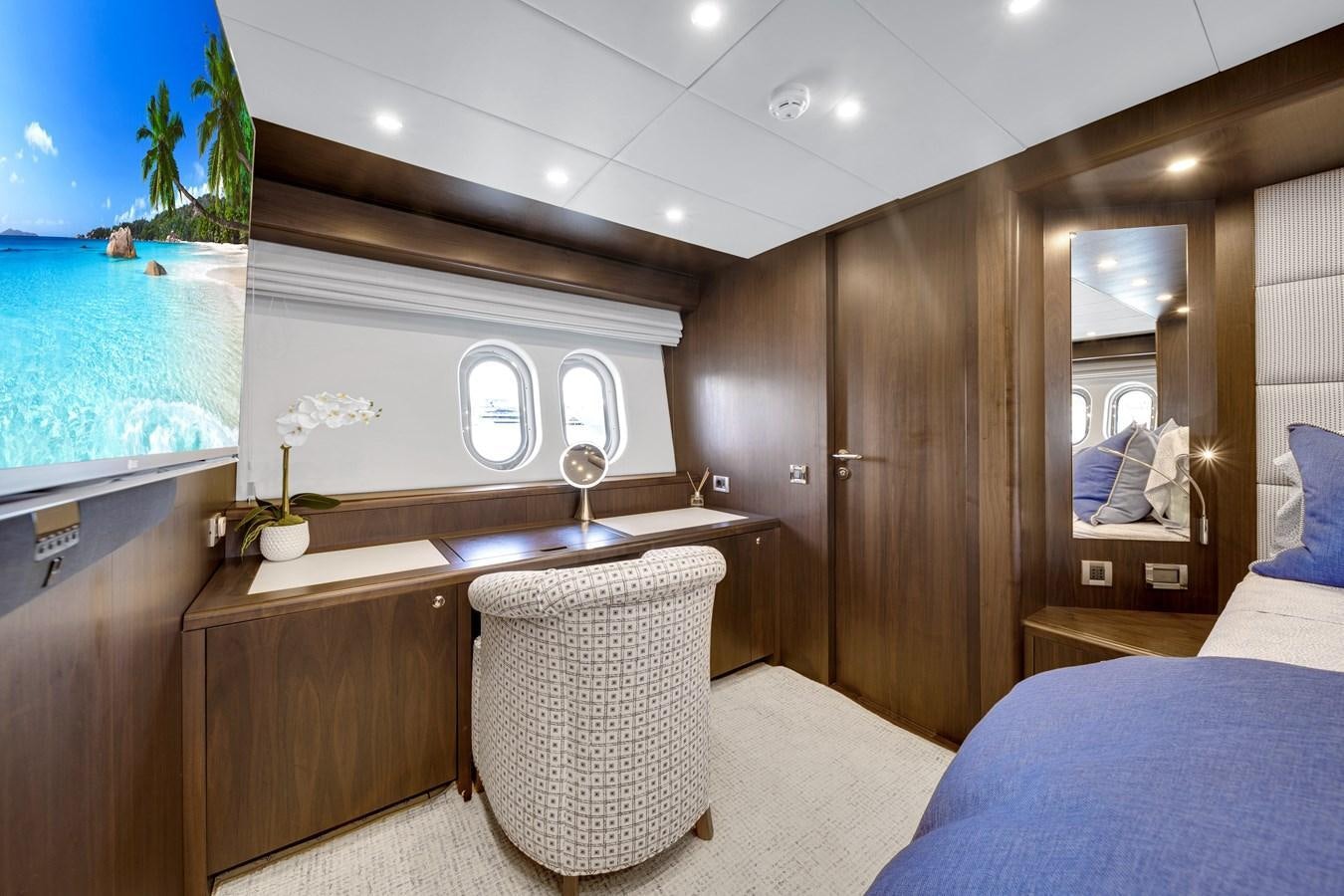 a room with a table and chairs aboard FAMILYBILT Yacht for Sale