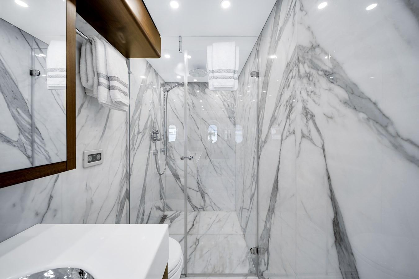 a bathroom with a shower aboard FAMILYBILT Yacht for Sale