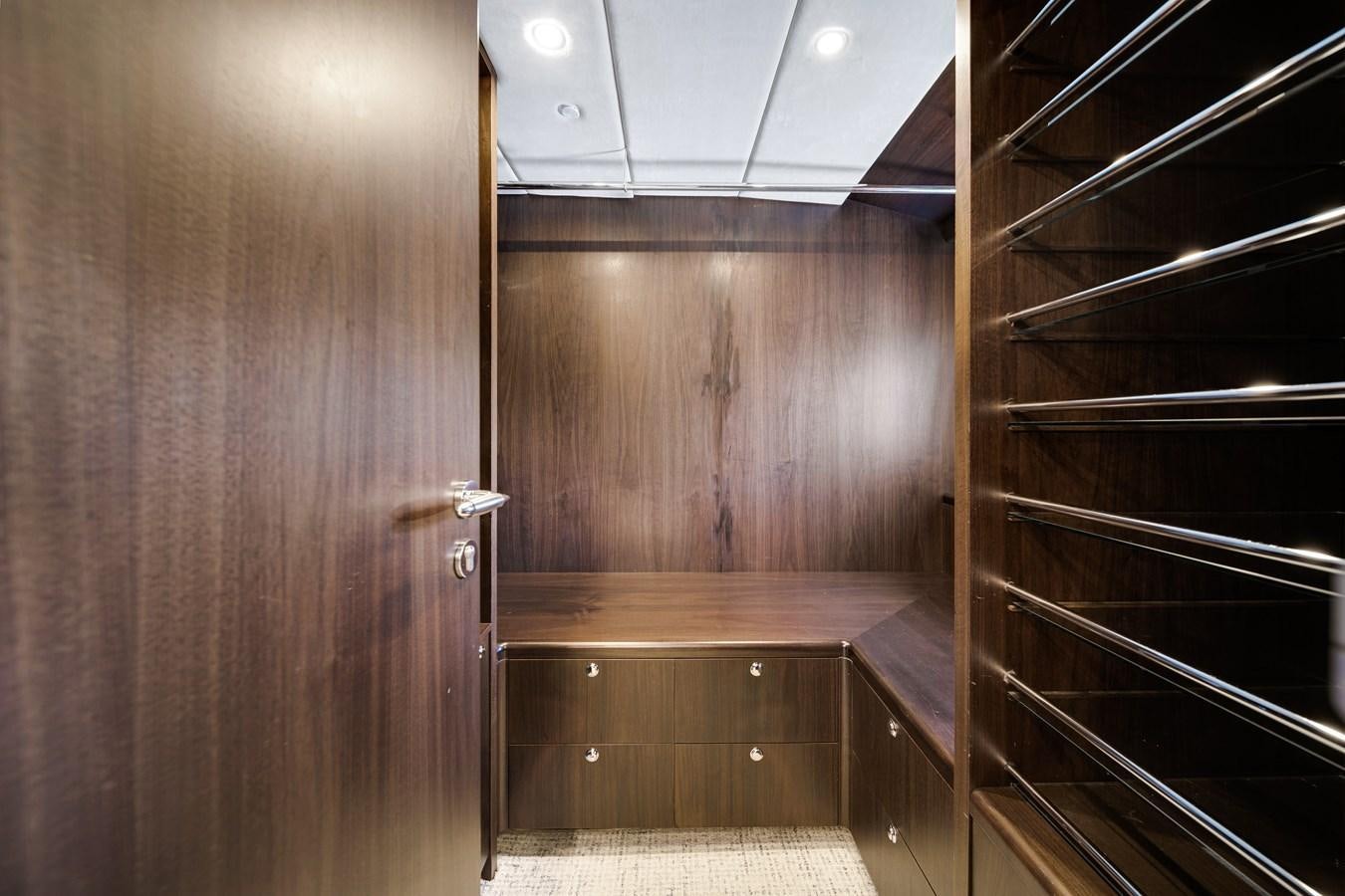 a room with wooden cabinets aboard FAMILYBILT Yacht for Sale