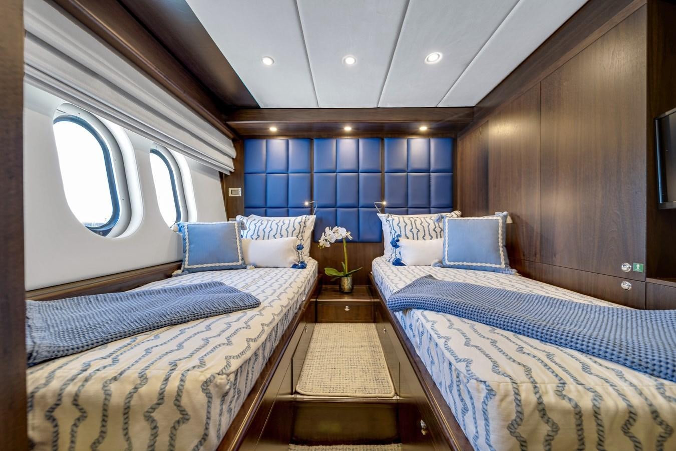 a room with a couple of beds aboard FAMILYBILT Yacht for Sale